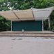 A teeny seven-year-old sits entirely alone on a dilapidated bandstand during the peak of Go Fest 2022.